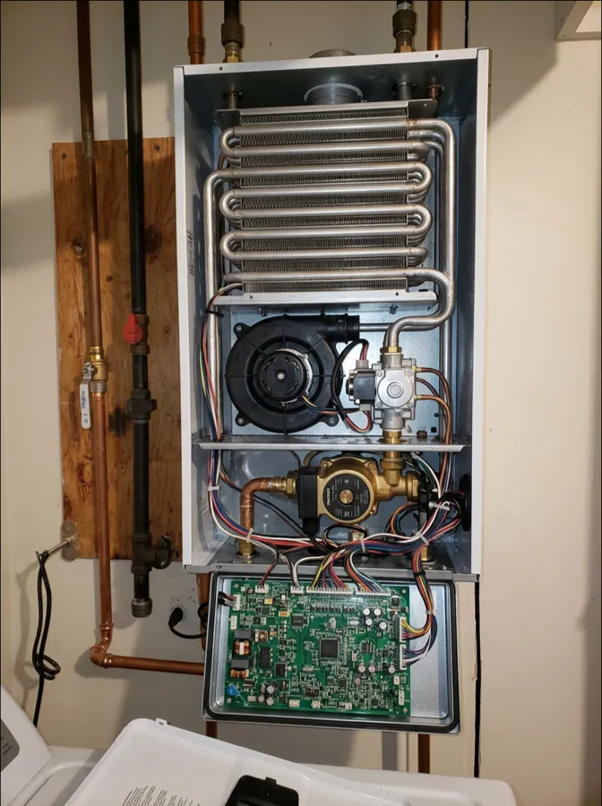 Wall-hung boiler opened for repair by American Way