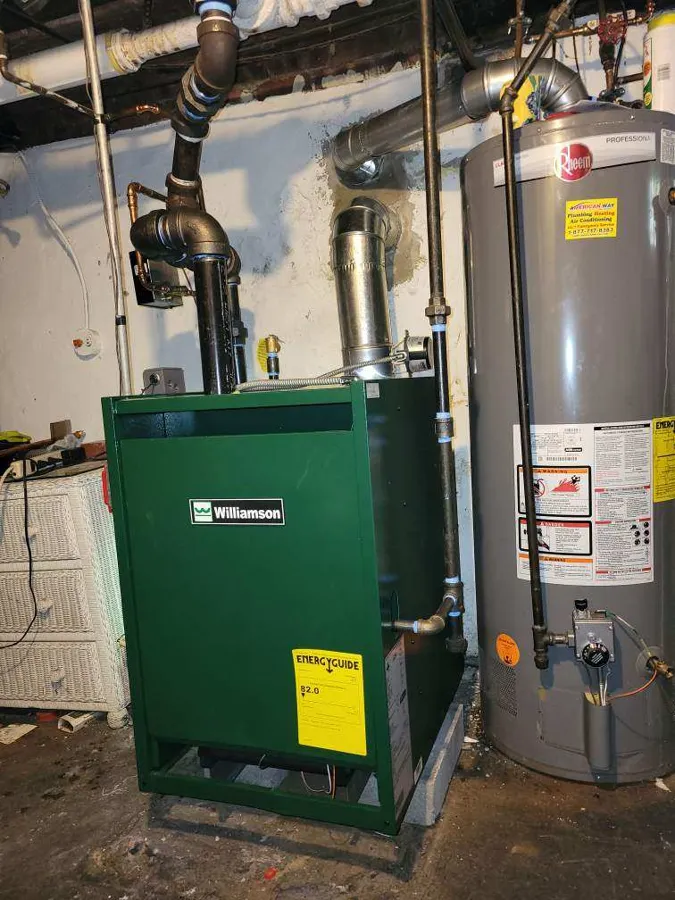 New boiler installed by American Way next to a water heater